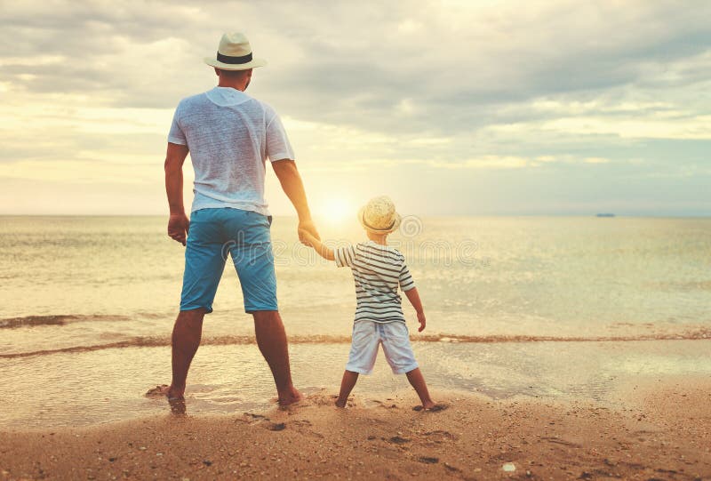 Happy fathers day. family dad and child son at sea beach. Happy fathers day. family dad and child son at sea beach